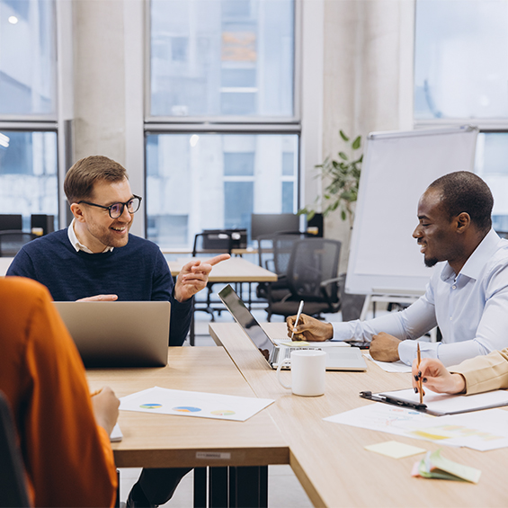 Two professionals talking in an office